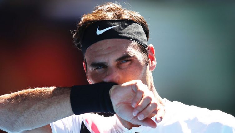 Roger Federer watches on