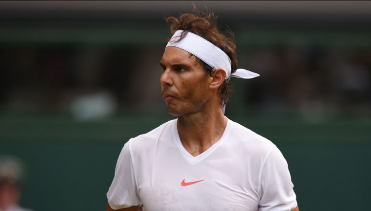 Rafael Nadal looks on
