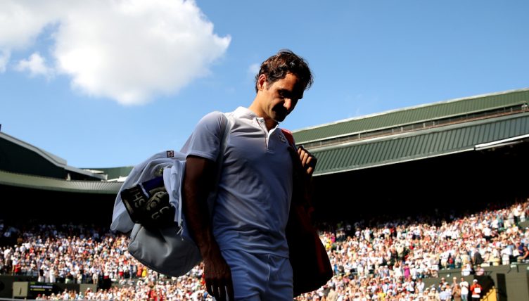 Roger Federer walks of disappointed at Wimbledon