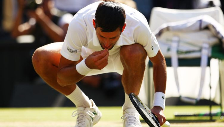 Novak Djokovic tests the grass at Wimbledon