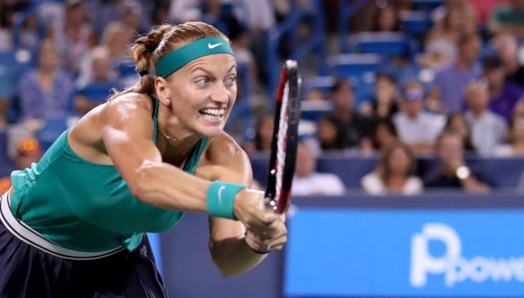 Petra Kvitova reaching for a ball