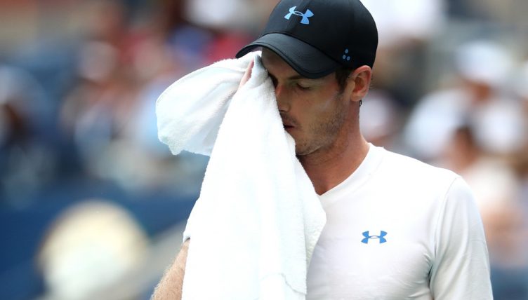 Andy Murray wipes his face