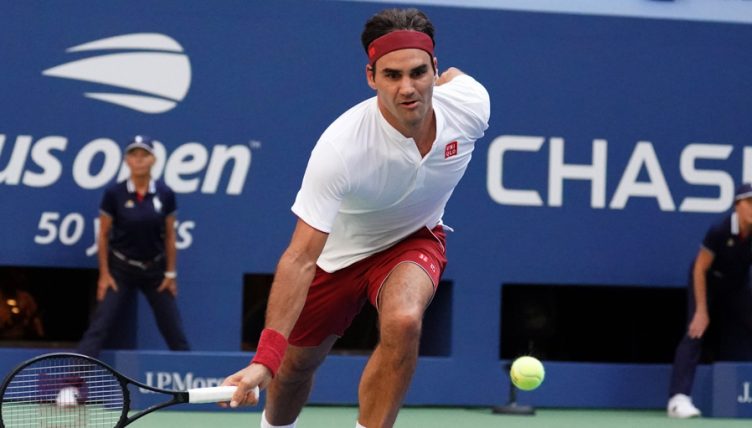Roger Federer stooping