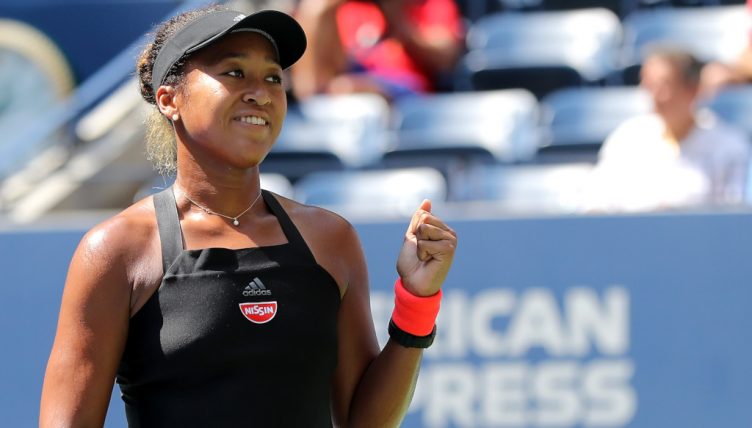 Naomi Osaka celebrates.