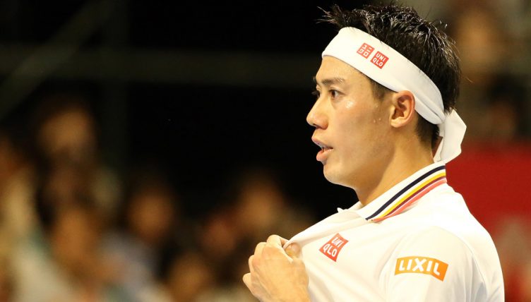 Kei Nishikori looks on