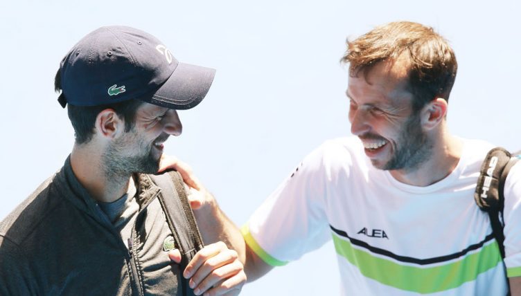 Novak Djokovic and Radek Stepanek share a joke