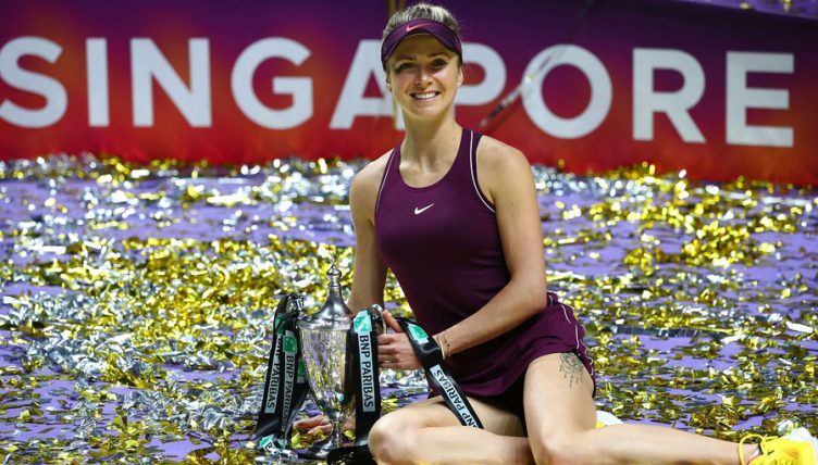 Elina Svitolina celebrates with WTA Finals trophy
