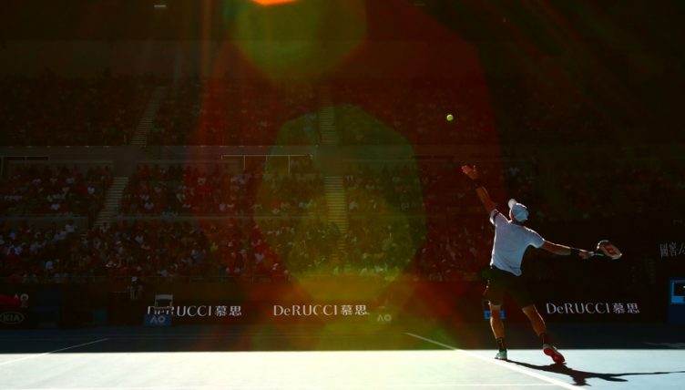 Kyle Edmund serves at Australian Open