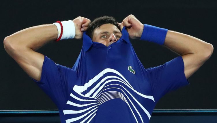 Novak Djokovic takes his shirt off
