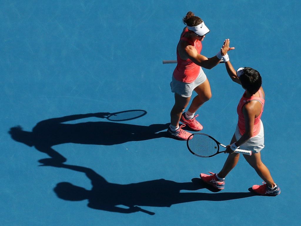 Sam Stosur and Shuai Zhang in action
