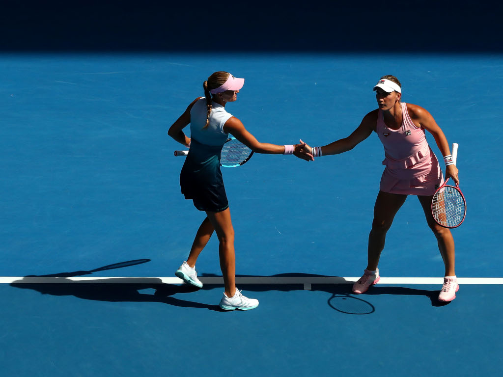Timea Babos and Kristina Mladenovic in action