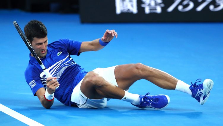 Novak Djokovic hits the floor