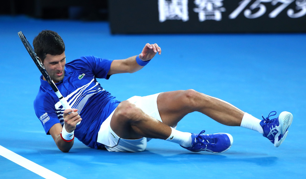 Novak Djokovic hits the floor