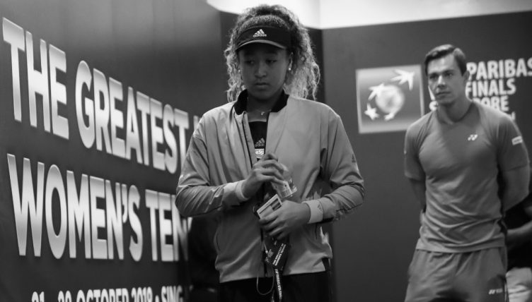 Naomi Osaka and Sascha Bajin enter court