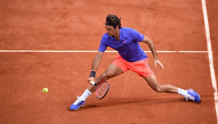Roger Federer sliding on clay
