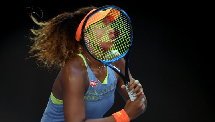 Naomi Osaka behind the racket