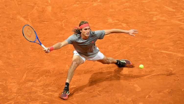 Stefanos Tsitsipas sliding
