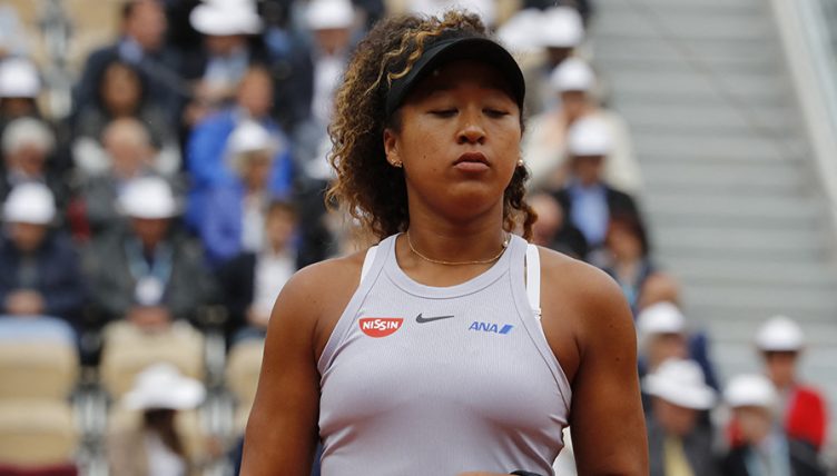 Naomi Osaka looks dejected at French Open PA