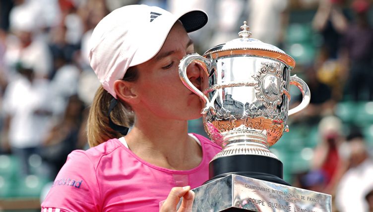 Justine Henin with French Open trophy PA