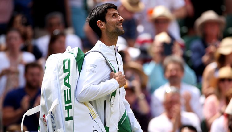 Novak Djokovic walking out at Wimbledon