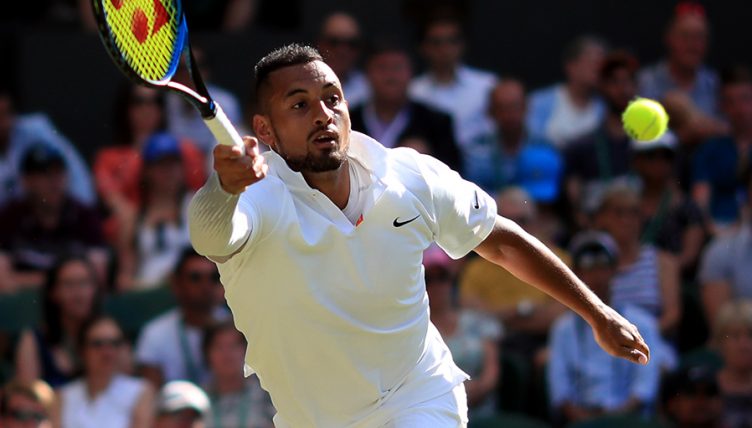 Nick Kyrgios reaches for ball at Wimbledon