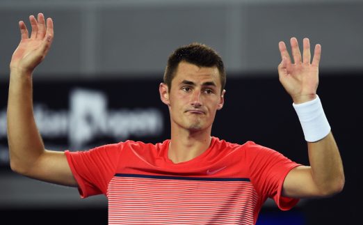 Bernard Tomic hands up