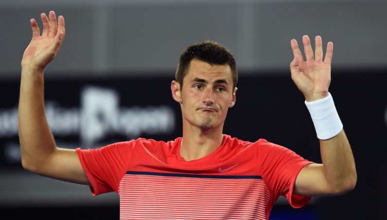 Bernard Tomic hands up