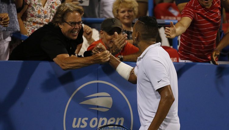 Nick Kyrgios with fan after successful serve