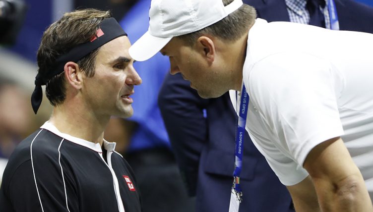 Roger Federer with physio at US Open