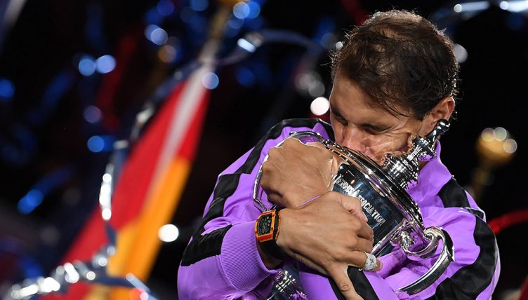 Rafael Nadal hugging US Open trophy