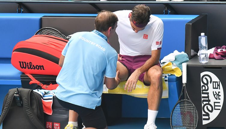 Roger Federer receiving treatment
