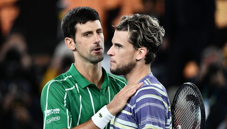 Dominic Thiem consoled by Novak Djokovic
