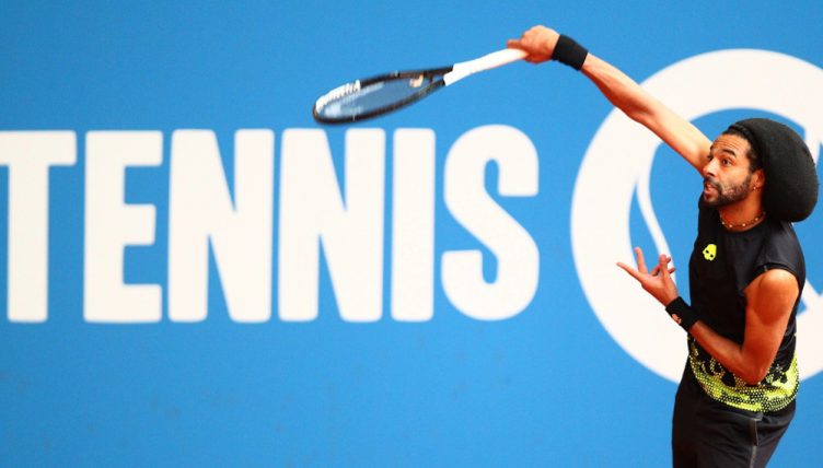 Dustin Brown serving