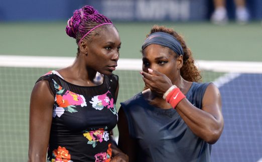 Venus Williams and Serena Williams in action
