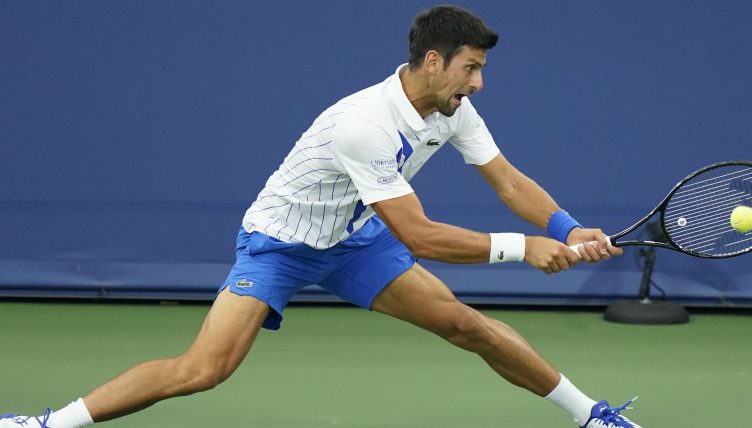 Novak Djokovic sliding