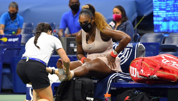 Serena Williams receives treatment on her foot