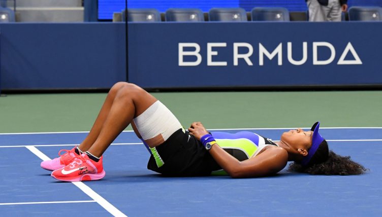 Naomi Osaka hits the floor after winning US Open