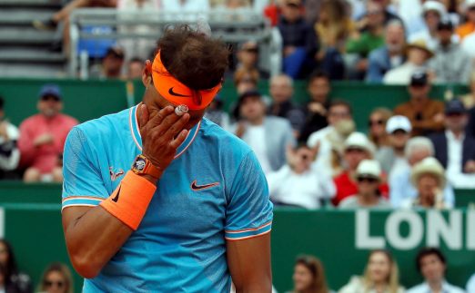 Rafael Nadal wipes his face