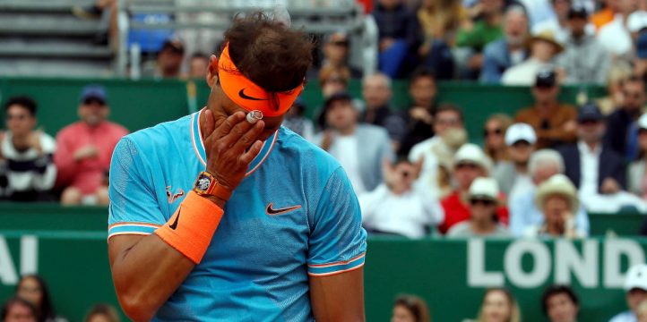 Rafael Nadal wipes his face
