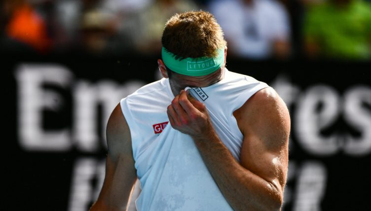 Tennys Sandgren wipes his face