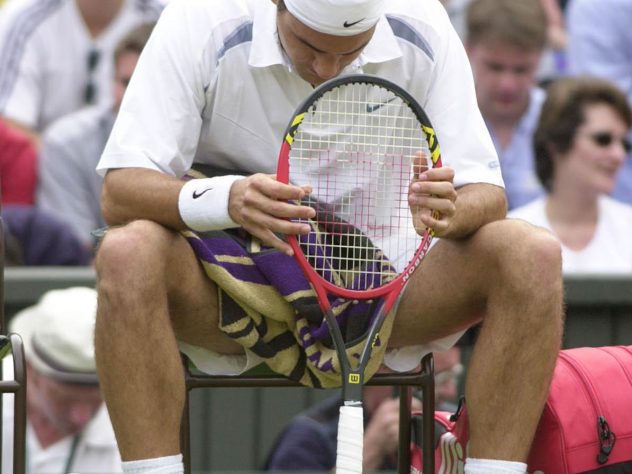 cA disconsolate Federer, the seventh seed, reflects on his defeat to 18-year-old Mario Ancic in the first round at Wimbledon in 2002