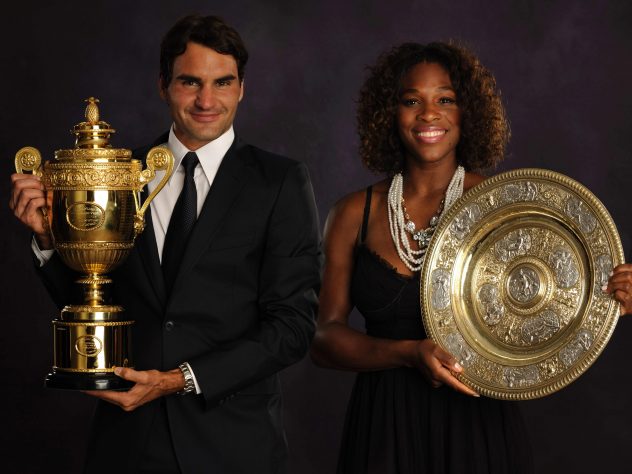 Federer poses alongside women's singles champion Serena Williams after landing Wimbledon title number six in 2009
