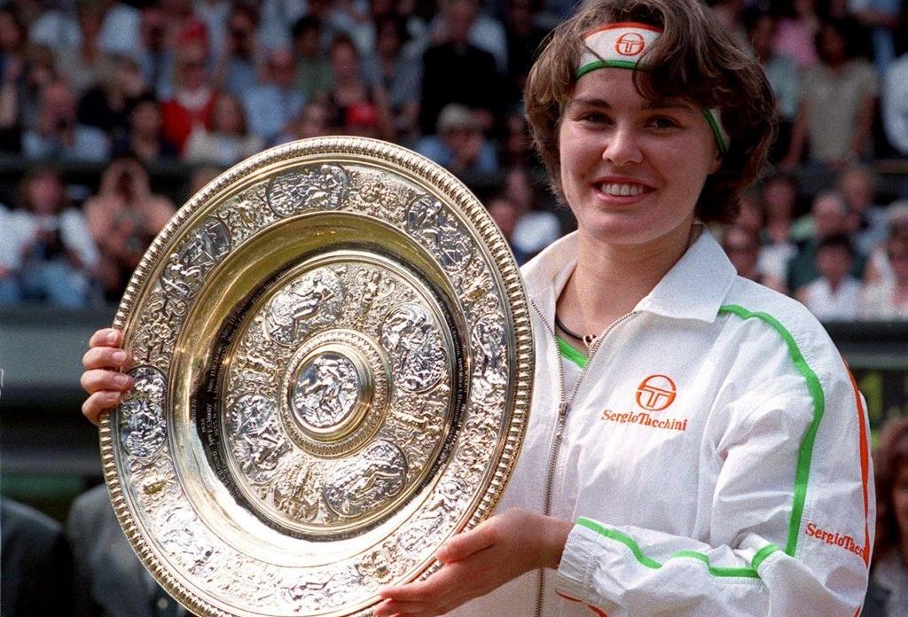Martina Hingis lifts Wimbledon trophy