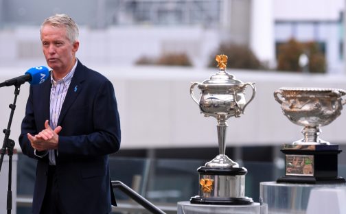 Tennis Australia CEO Craig Tiley with the Australian Open trophies