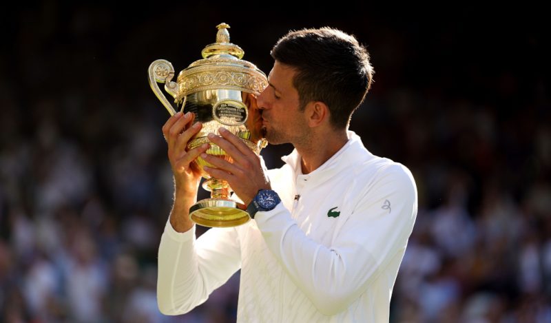 Novak Djokovic kisses the Wimbledon trophy