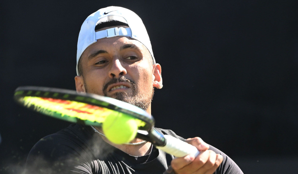 Nick Kyrgios plays a shot