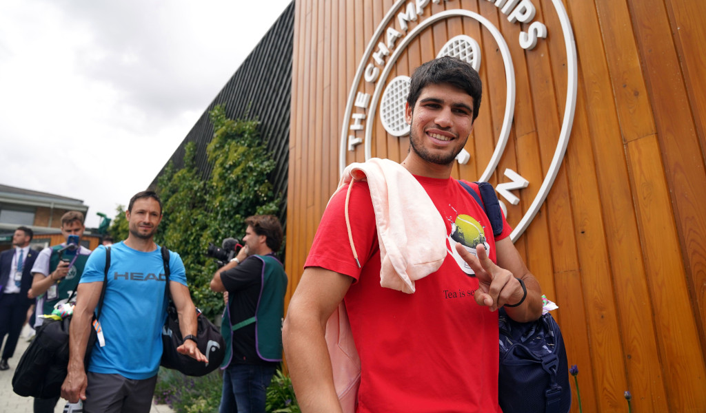 Carlos Alcaraz smiles Wimbledon