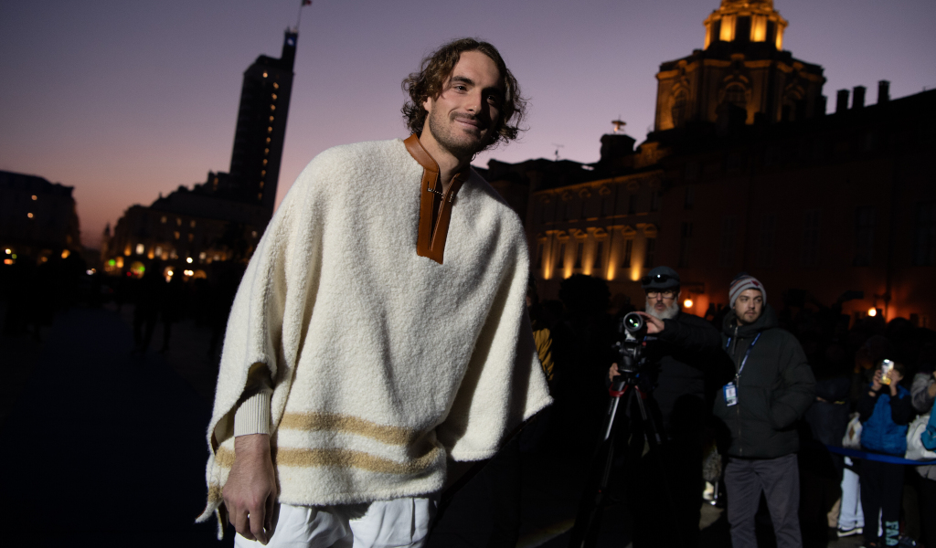 Stefanos Tsitsipas in a poncho