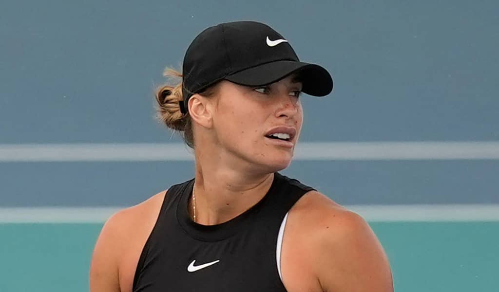 Aryna Sabalenka looks on