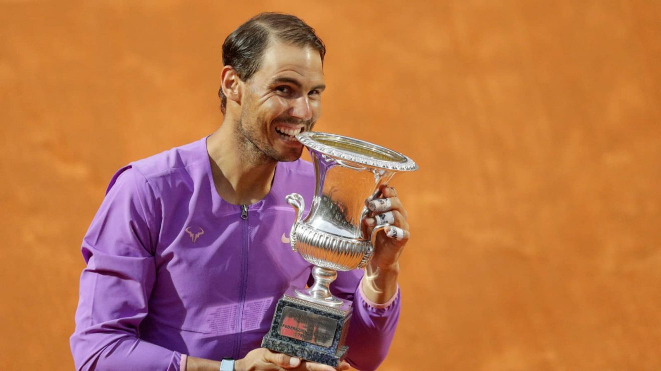 Spain's Rafael Nadal celebrates with the trophy after winning the Italian Open tennis tournament, in Rome, Sunday, May 16, 2021. Nadal defeated Serbia's Novak Djokovic 7-5, 1-6, 6-3